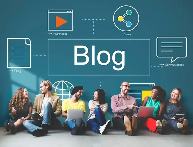 image that says "Blog" with seven people sitting on the floor below it